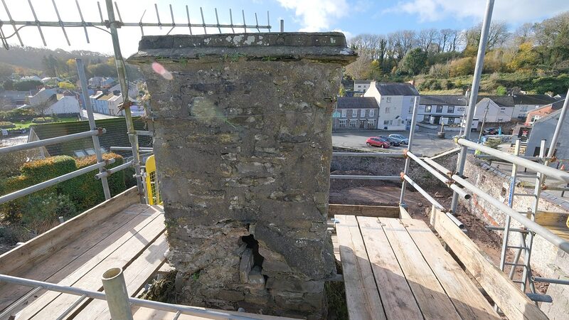 Island House under scaffolding during the chimney repairs of November 2020, the roof stripped back to its timbers.